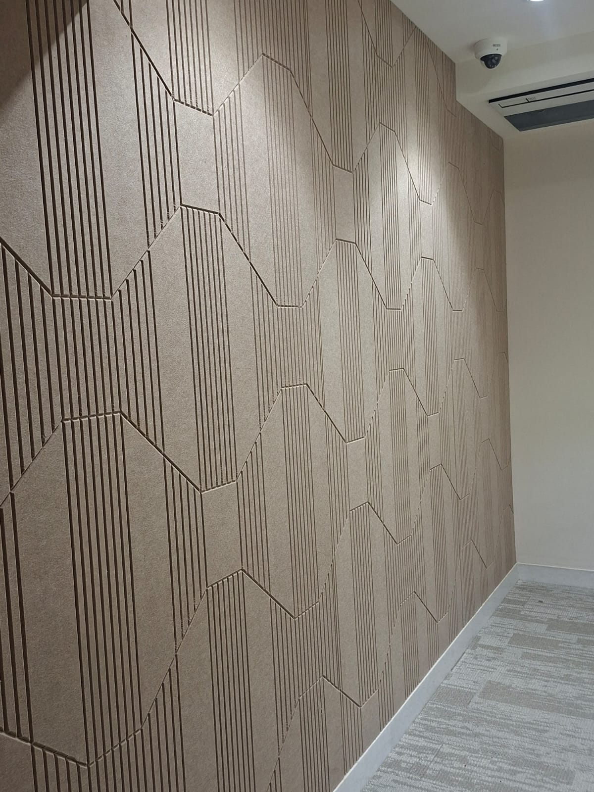 Textured geometric acoustic wall panel detail